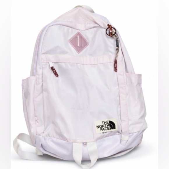 north face backpack white and pink The Youth Mini Explorer an internal organization sleeve and an external bungee cord system Womens The North Face Borealis